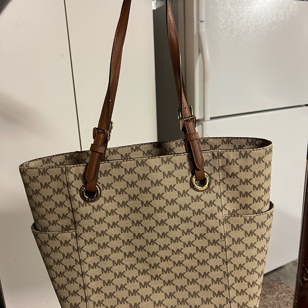 Michael Kords bag with tags on